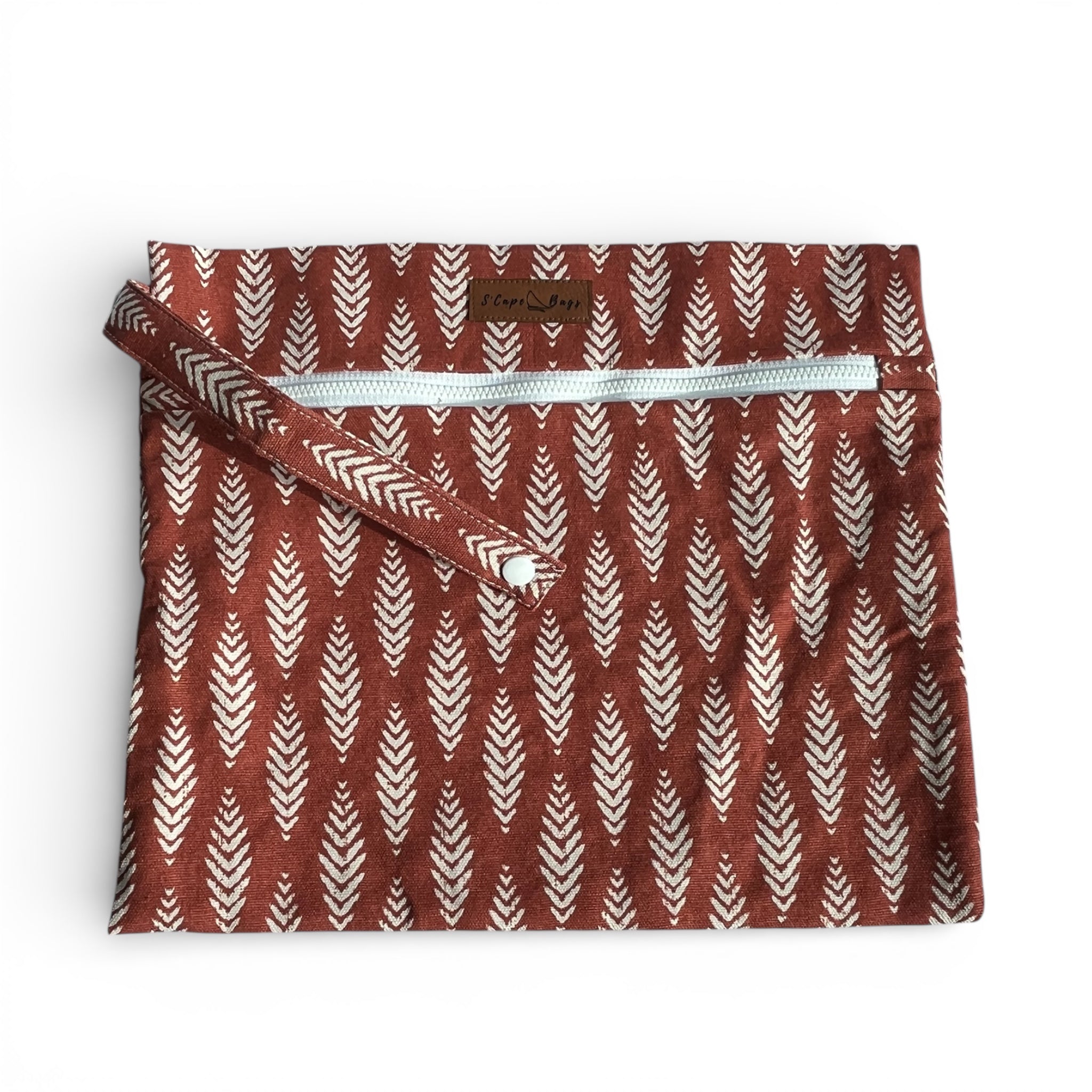 Fabric pouch with leaf pattern and zipper on a white background