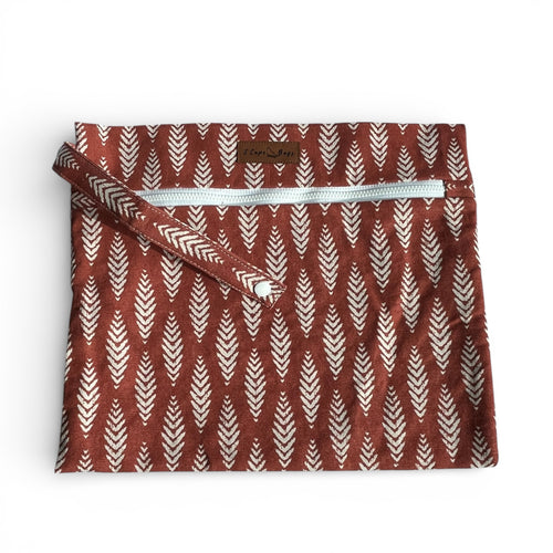 Fabric pouch with leaf pattern and zipper on a white background