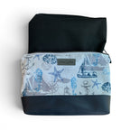 Nautical-themed pouch with waterproof black interior. 