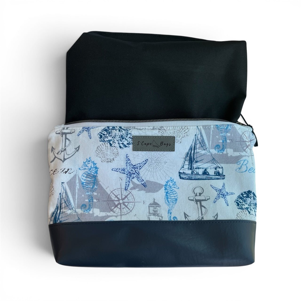 Nautical-themed pouch with waterproof black interior. 